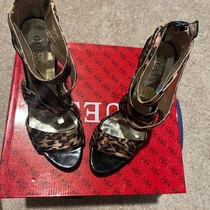 Guess cut out with 4 inch  heels. Zipper up the back, animal print. Size 9 New